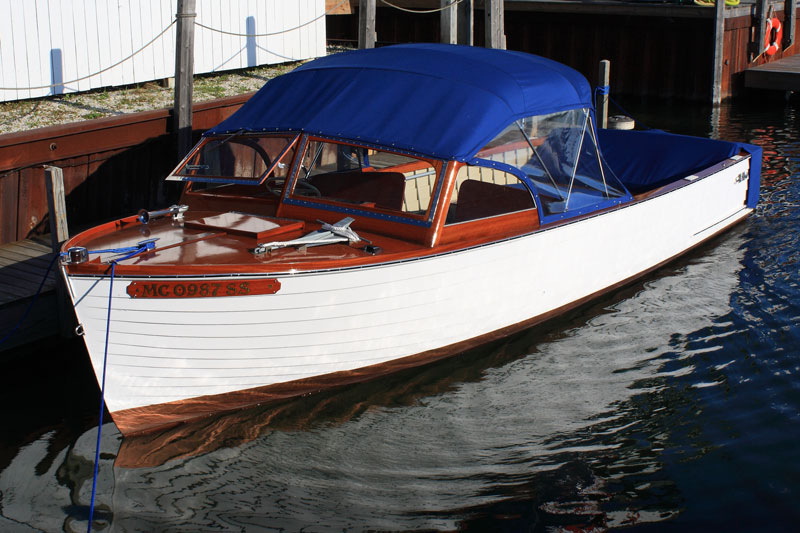 classic wooden boat docked in hessel michigan